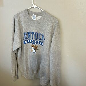 UK sweatshirt. It says adult L, but fits like a Medium to me. It's old!